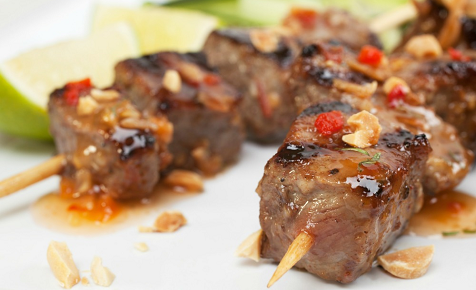 Beef skewers with sauce